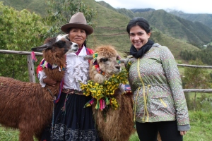 A traditional Quechua woman dressed with her llama & I.